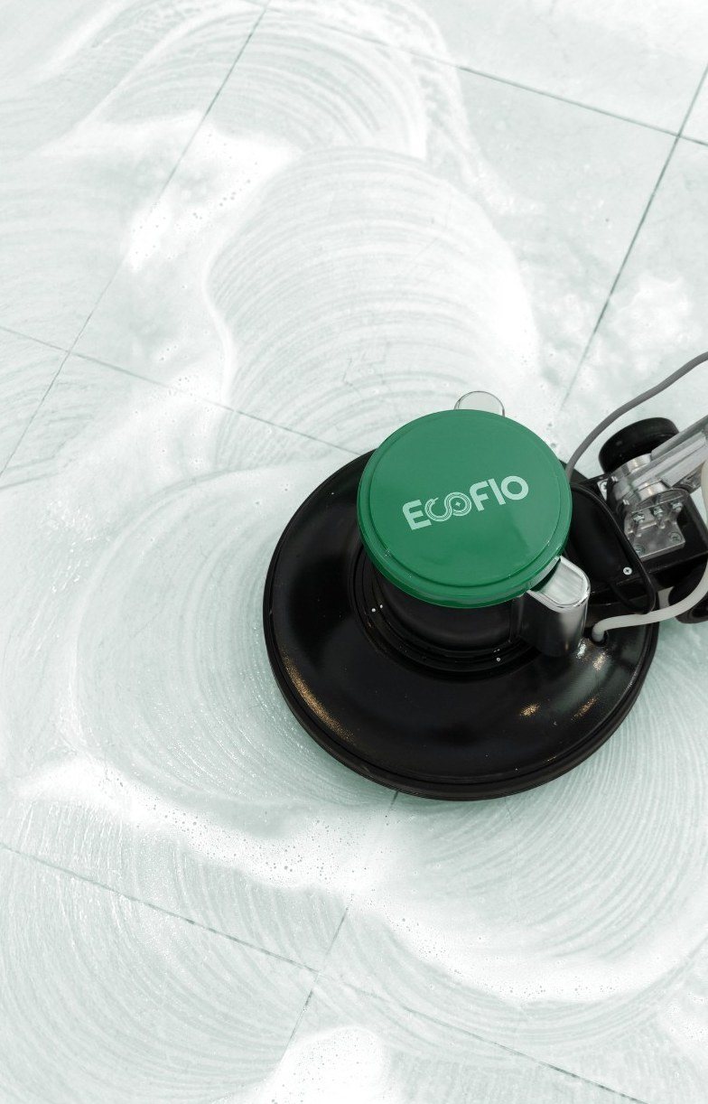 EcoFlo floor scrubbing machine polishing a tiled floor